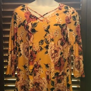 Beautiful yellow floral top with cross straps.